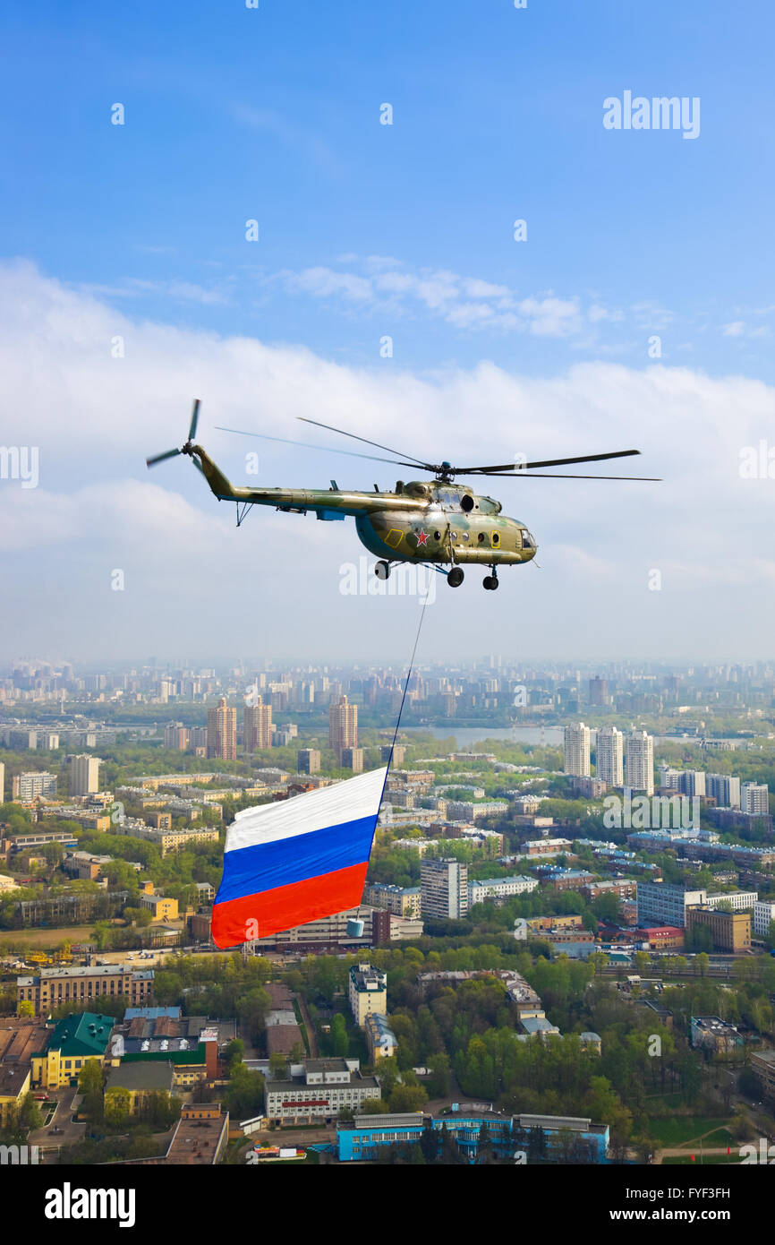 Helicopter with russian flag over Moscow at parade of victory day Stock Photo