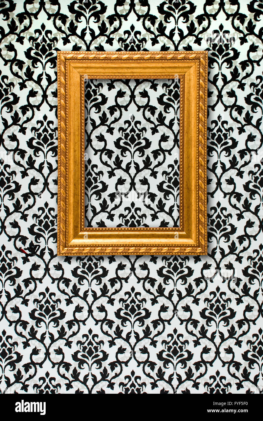 Gold frame on a black and white wallpaper Stock Photo Alamy