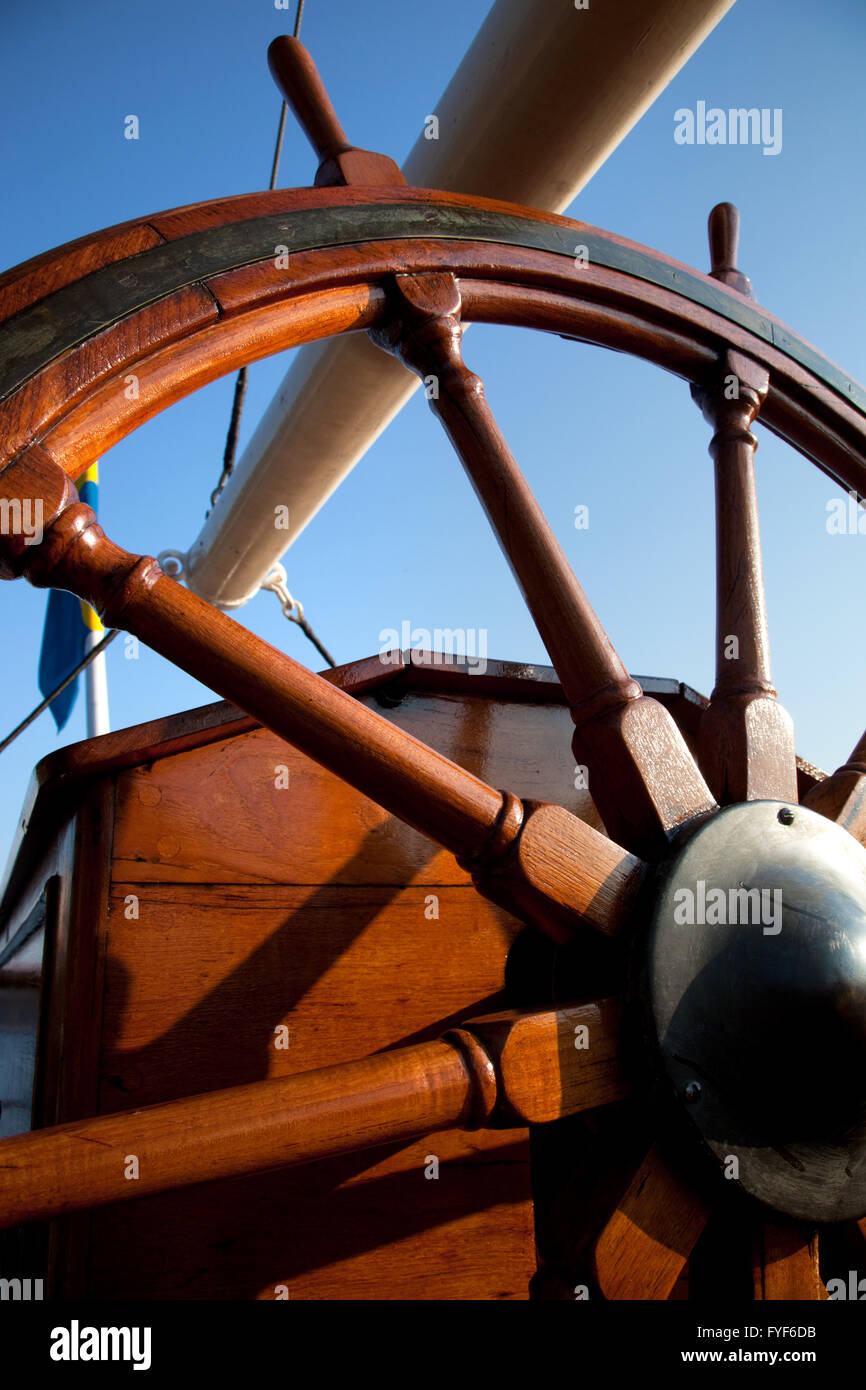 Old helm, wooden wheel for navigation Stock Photo