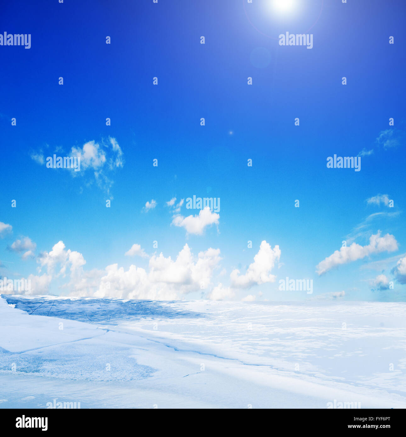 Snowy winter landscape and sunny blue sky Stock Photo