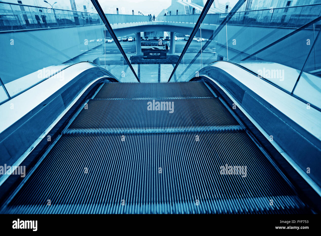 Moving up escalator Stock Photo