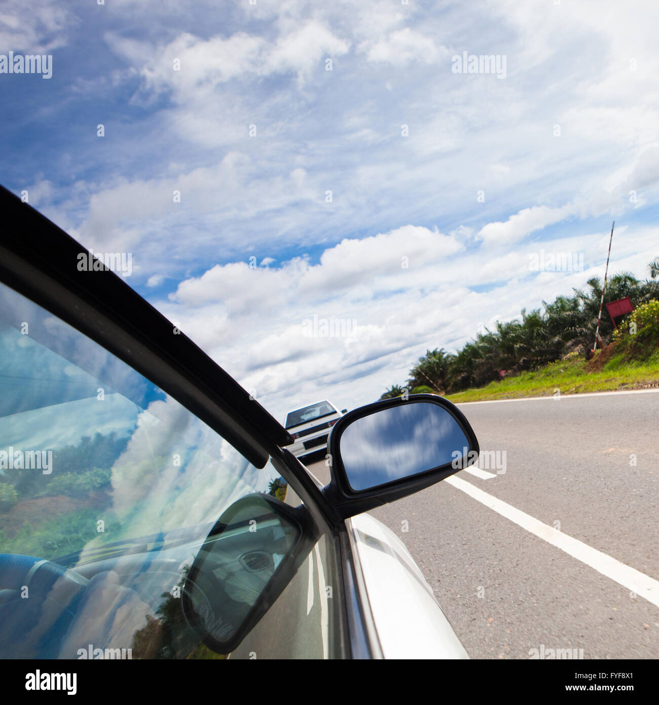 speed car driving at high speed on empty road motion blur Stock Photo