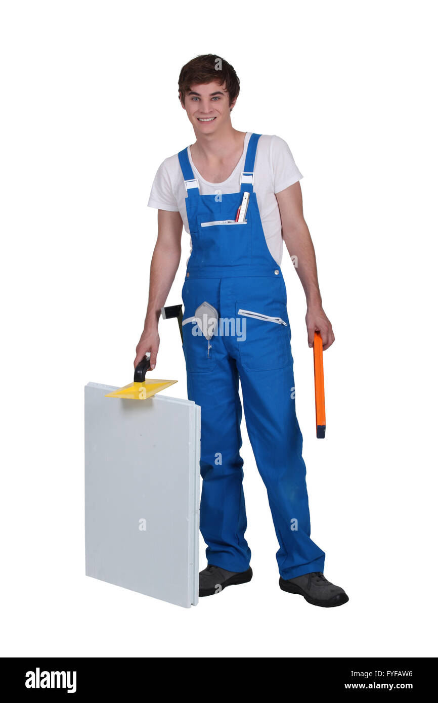 Studio shot of a young plasterer and equipment Stock Photo