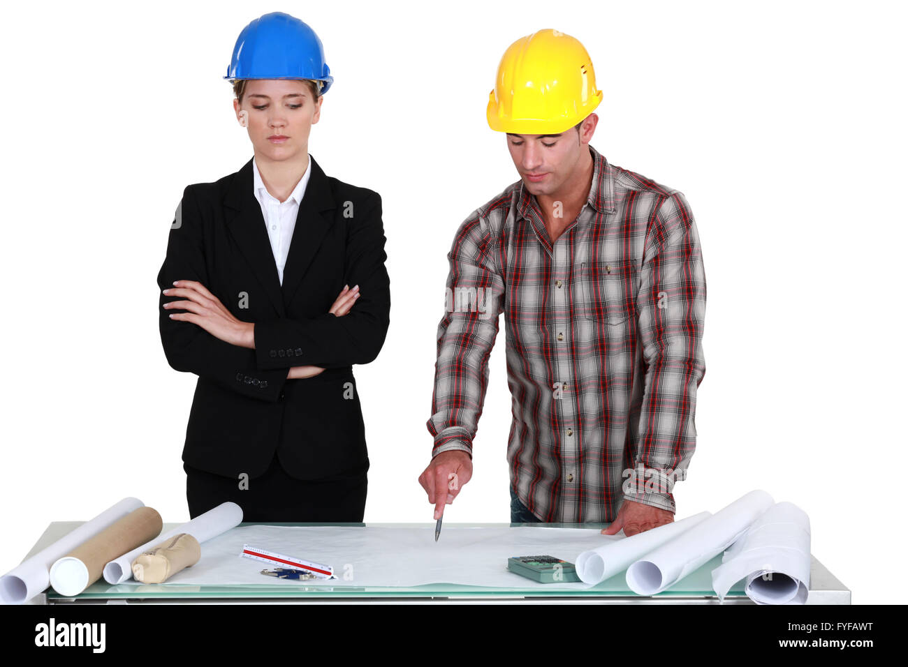 Tradesman pointing out an error to an engineer Stock Photo