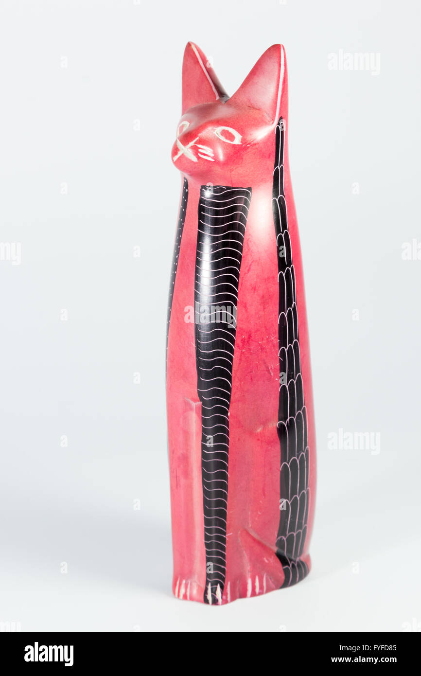 red and black porcelain cat on a white background Stock Photo Alamy
