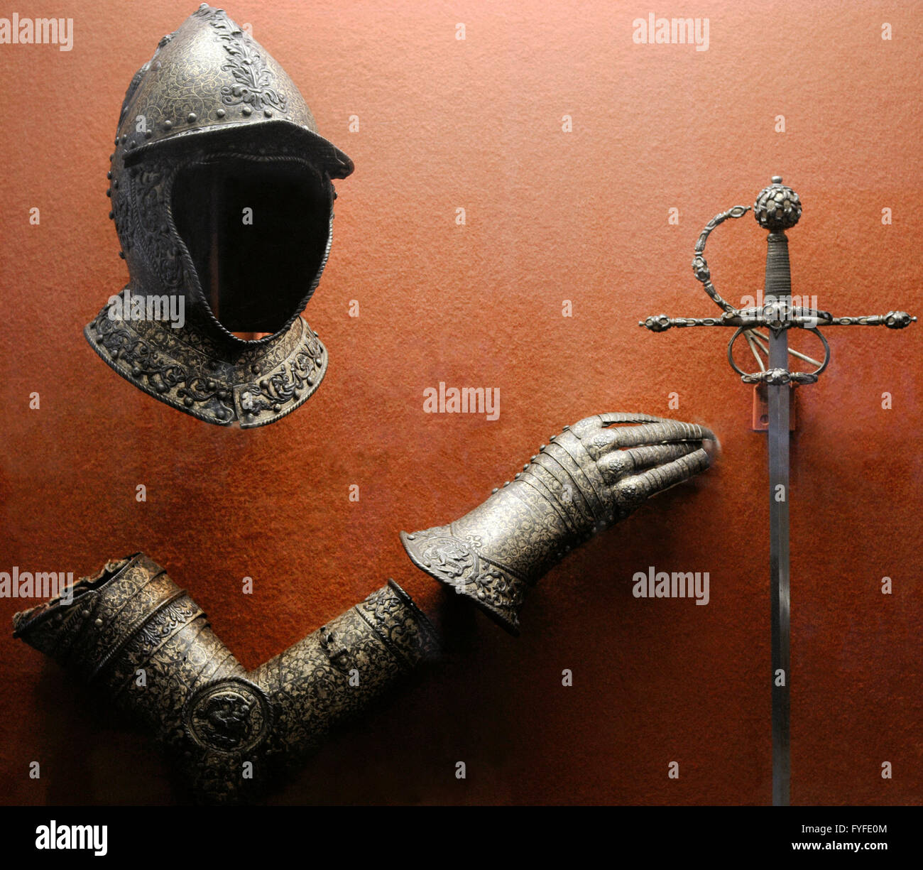 Parts of armor: helmet, vambrace or forearm guards and gauntlet. Ca. 1550-1560. Italy. Knights' Hall. The State Hermitage Museum. Saint Petersburg. Russia. Stock Photo