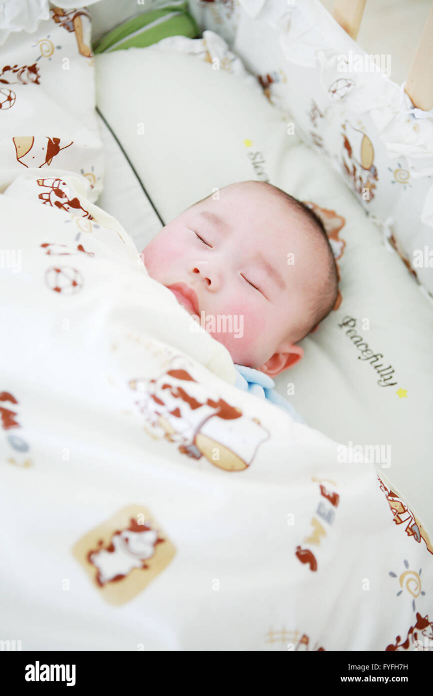 little baby sleeping in bed Stock Photo - Alamy