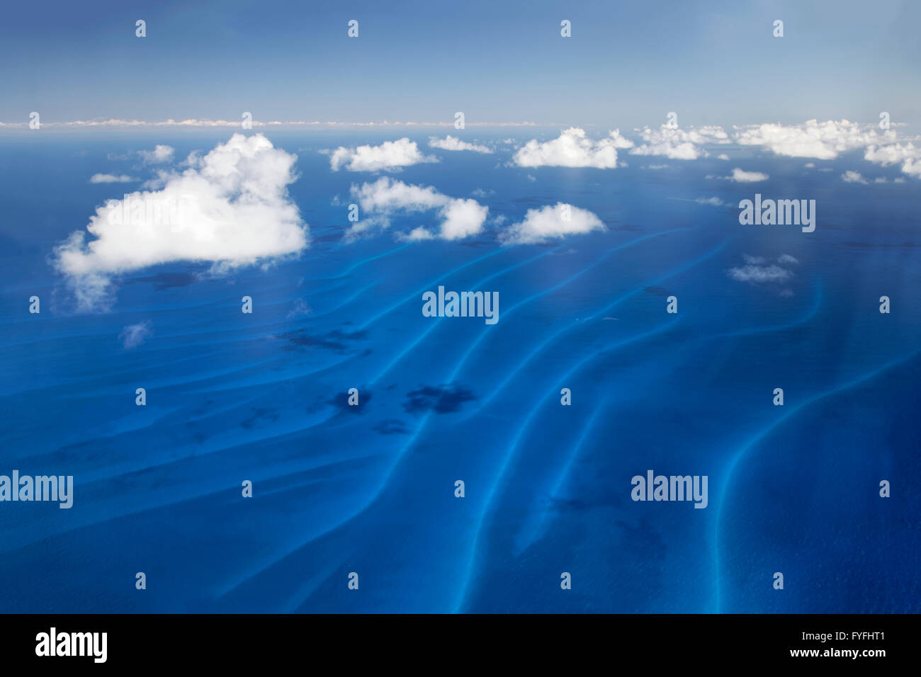 Sandbanks in the sea, small clouds over the Pacific, Queensland, Australia Stock Photo