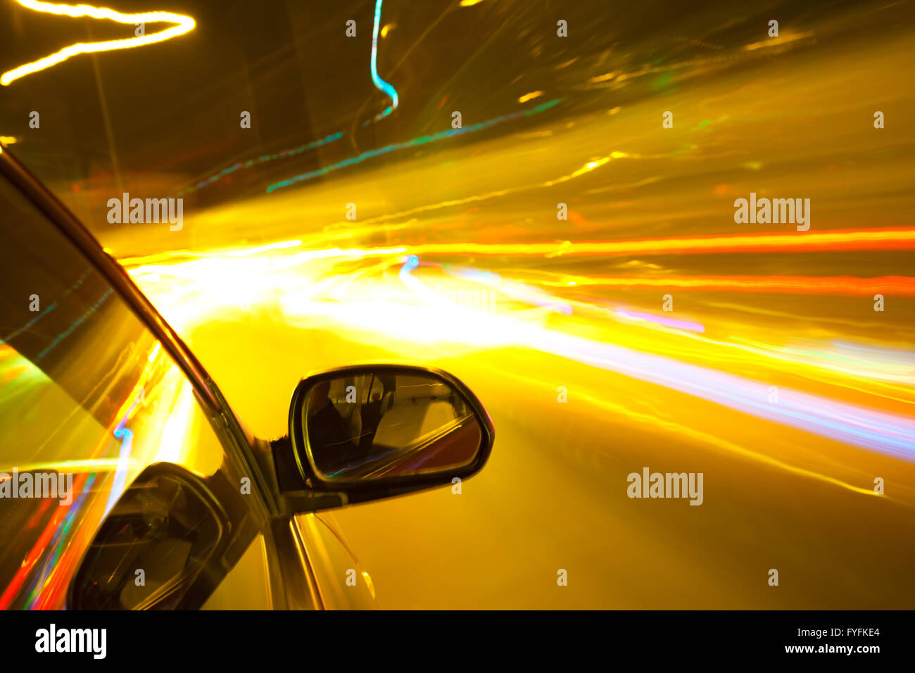 Night traffic,shoot from the window of rush car,motion blur steet light. Stock Photo