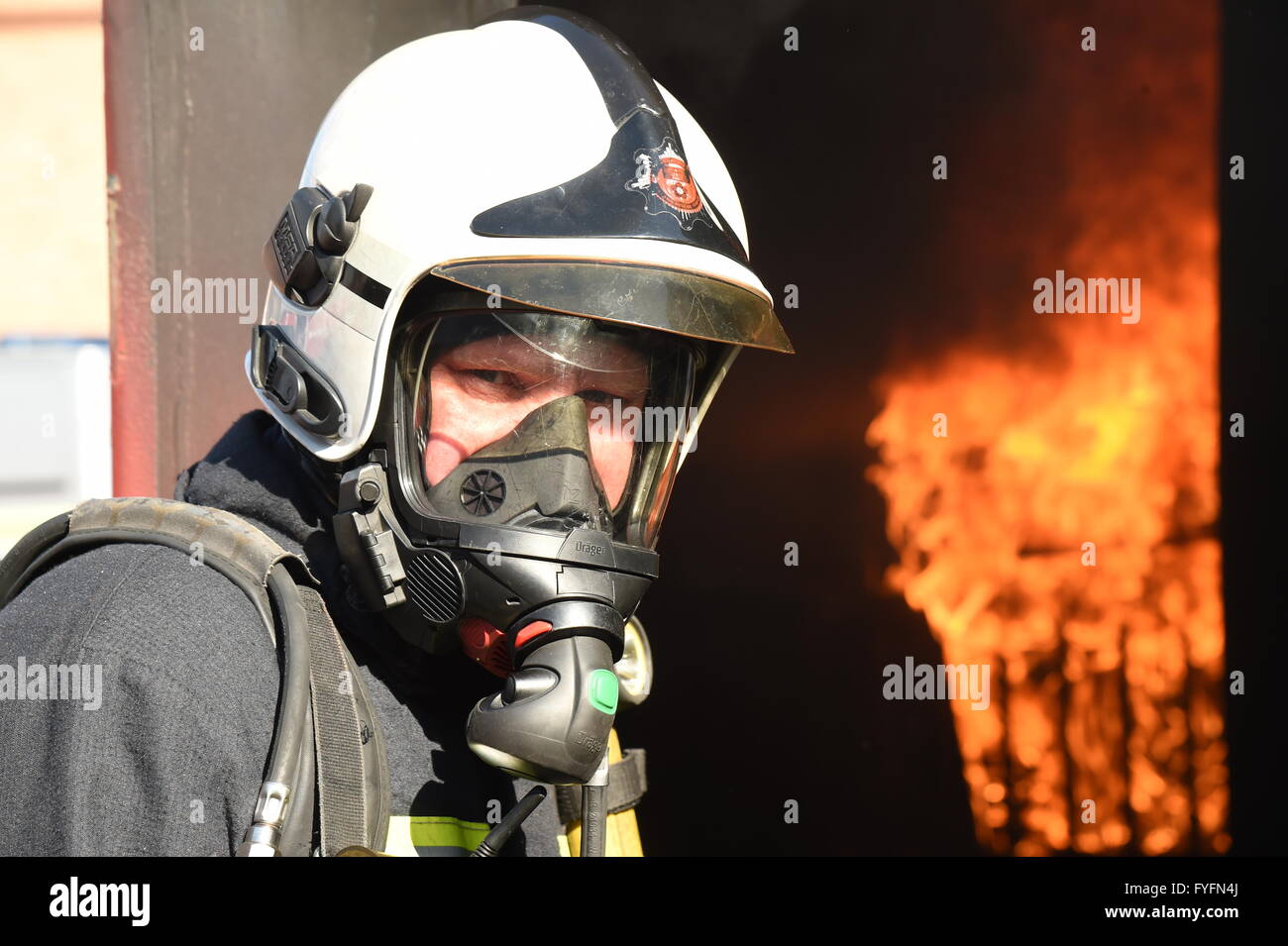 Firefighters tackle a blaze Stock Photo - Alamy