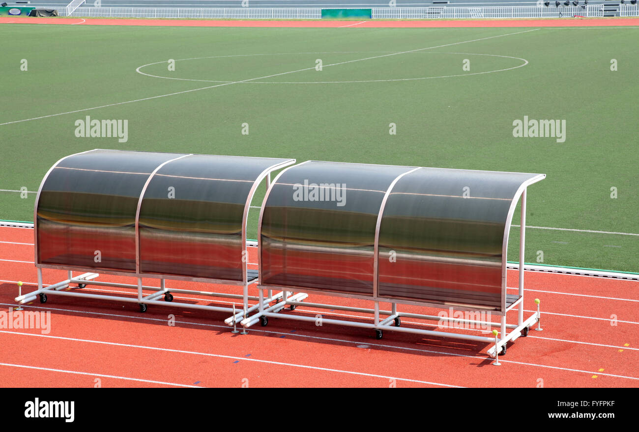 Coach and reserve benches in football stadium Stock Photo Alamy