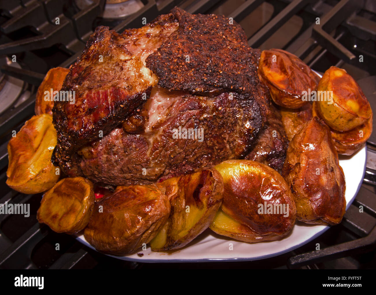 Roasted Prime Rib Roast with roasted potatoes Stock Photo