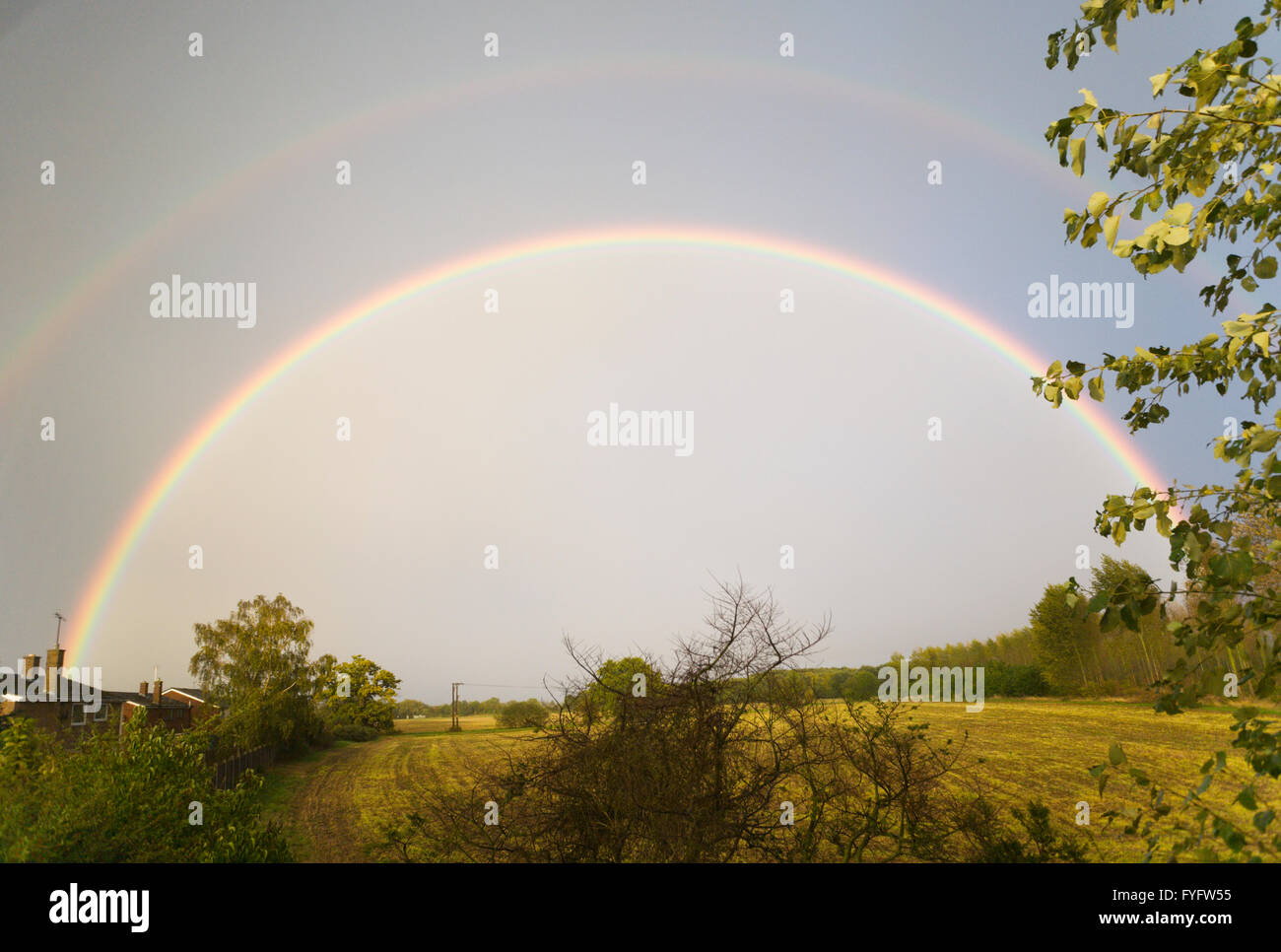 Double rainbow over a field in Ampthill, Bedfordshire, UK Stock Photo