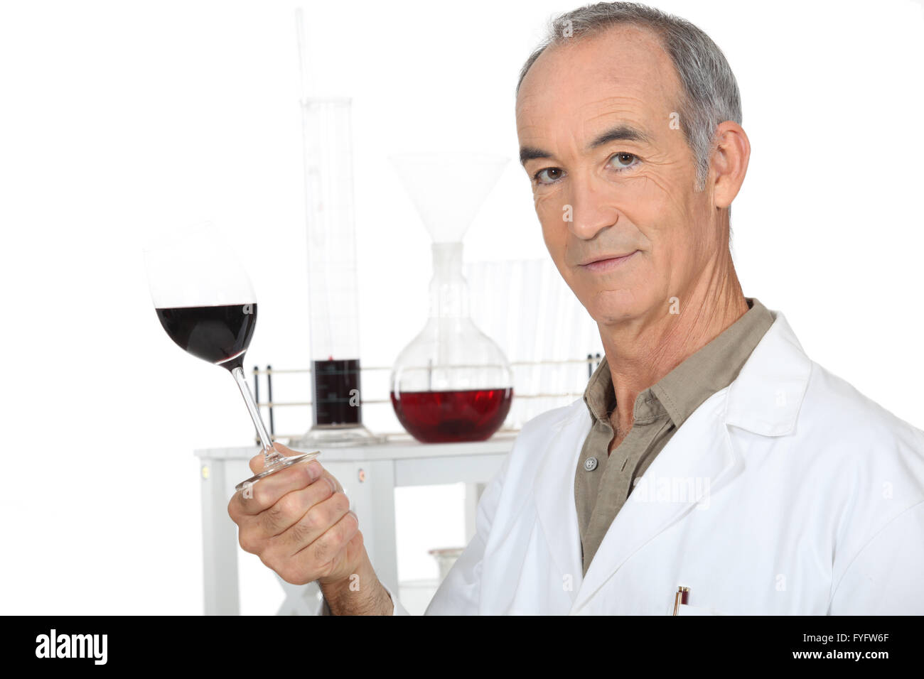 a scientist holding a wine glass in his laboratory Stock Photo Alamy