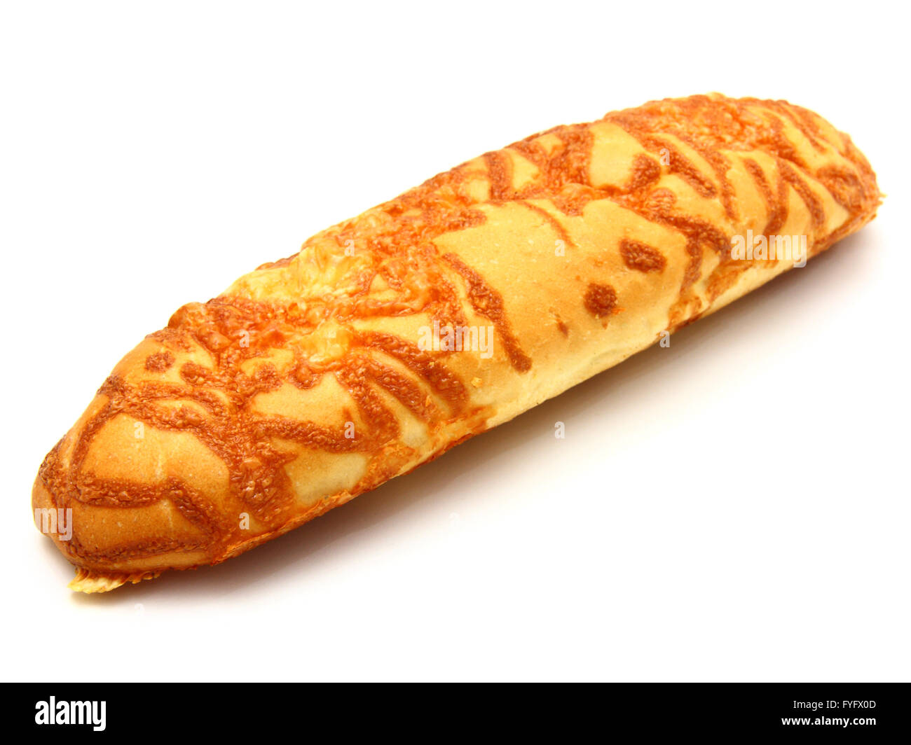The ruddy long loaf of bread is strewed by cheese Stock Photo