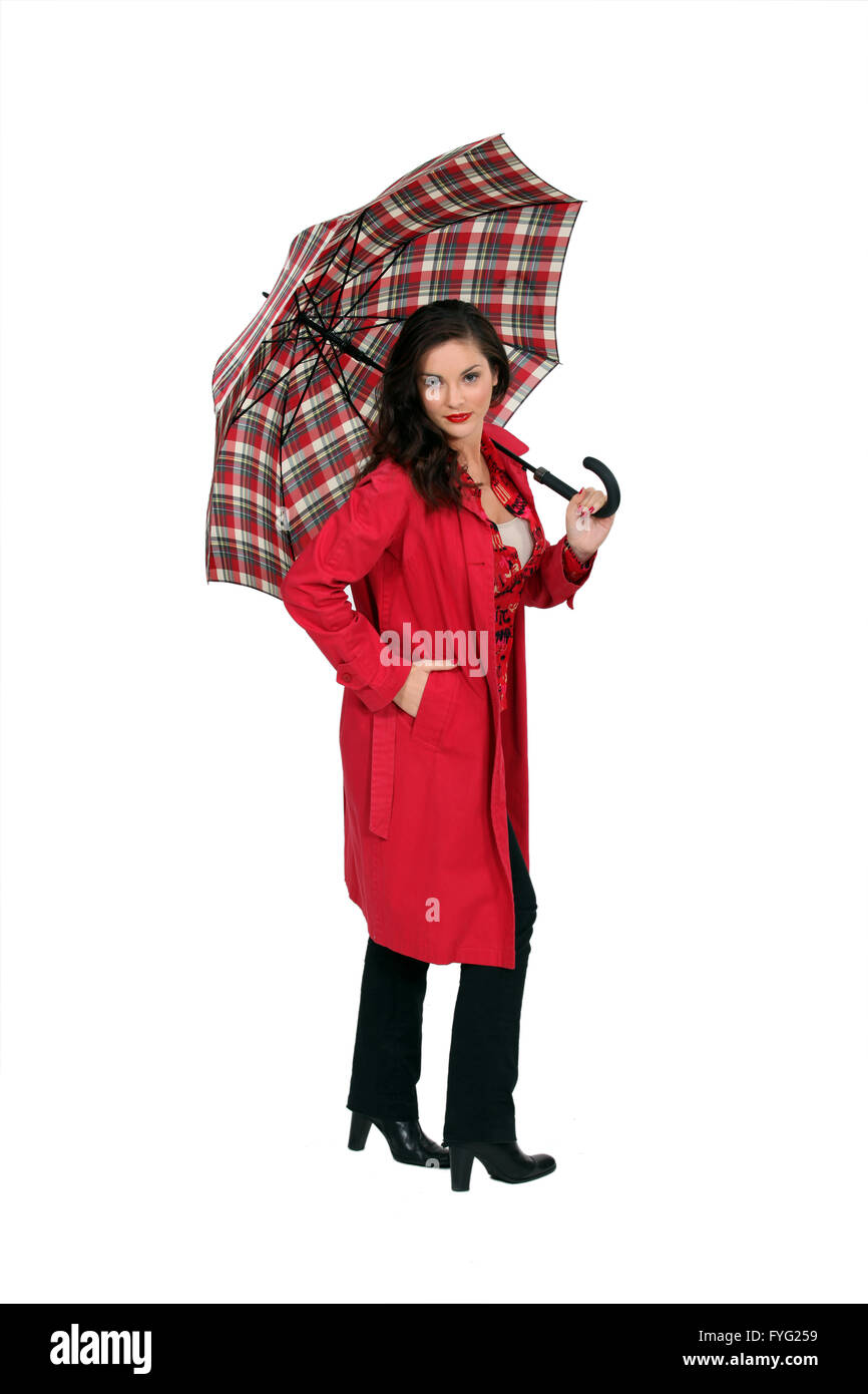 full-length portrait of glamorous brunette holding umbrella Stock Photo
