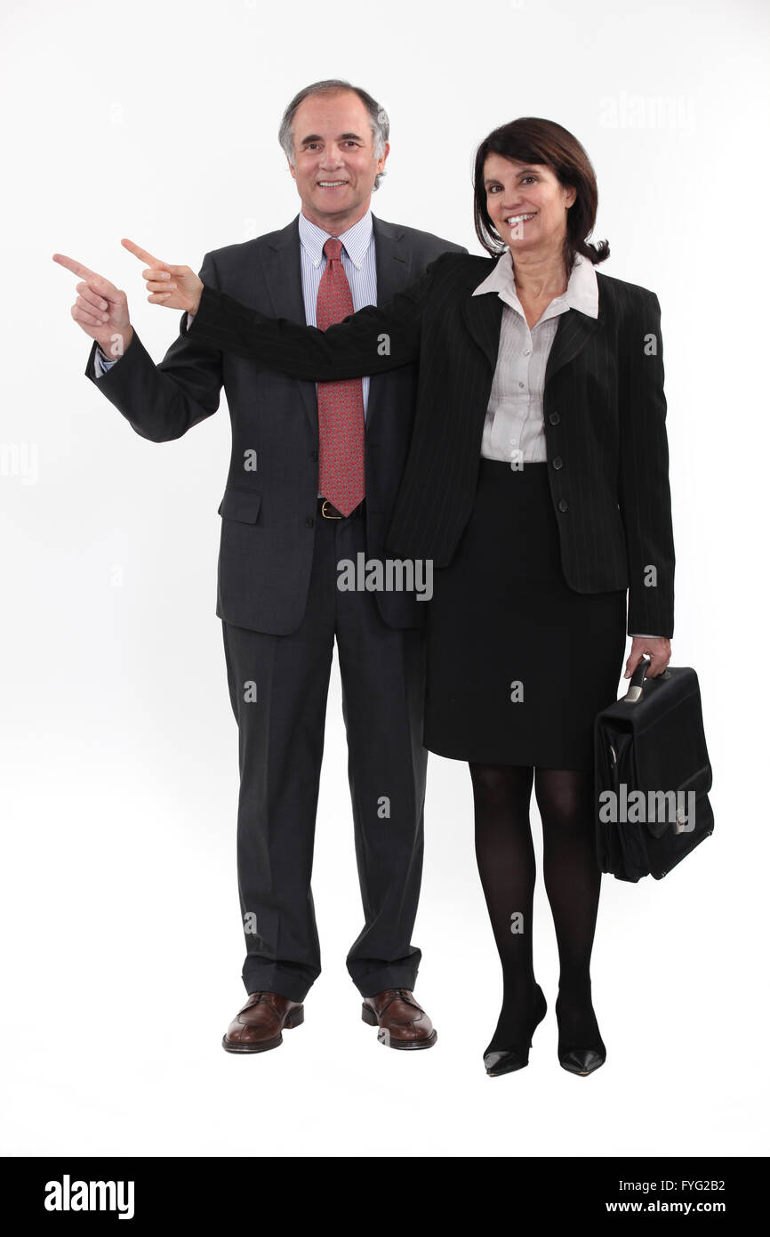 Mature businesspeople standing on white background Stock Photo