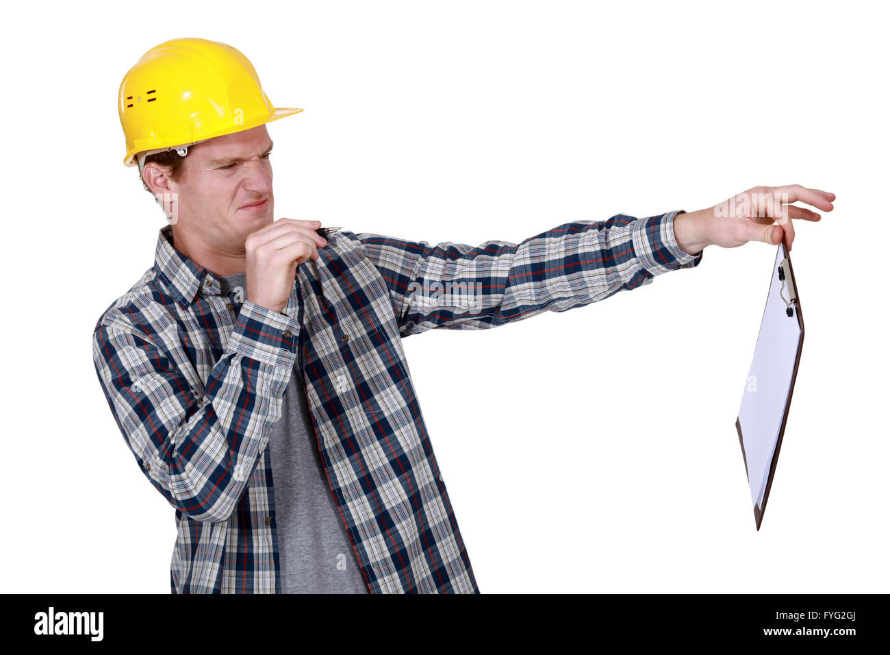 Construction worker holding a distasteful clipboard Stock Photo