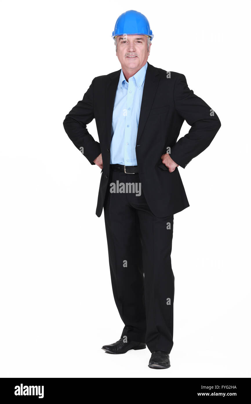 full-body picture of mature architect with arms akimbo Stock Photo
