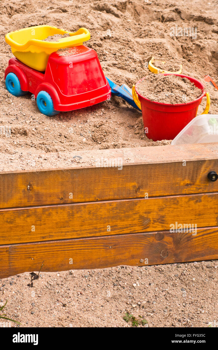 children toys in a sandpit Stock Photo