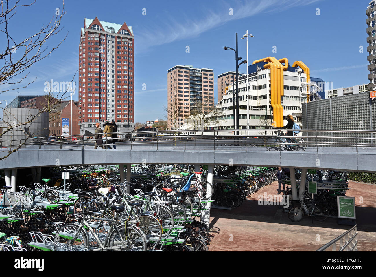 Public bike bicycle storage parking  park  city center of Rotterdam Blaak square  Netherlands Central Library  Residence Tower Stock Photo