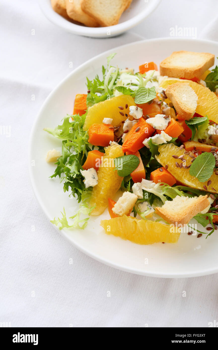 healthy pumpkin salad with oranges and cheeses Stock Photo