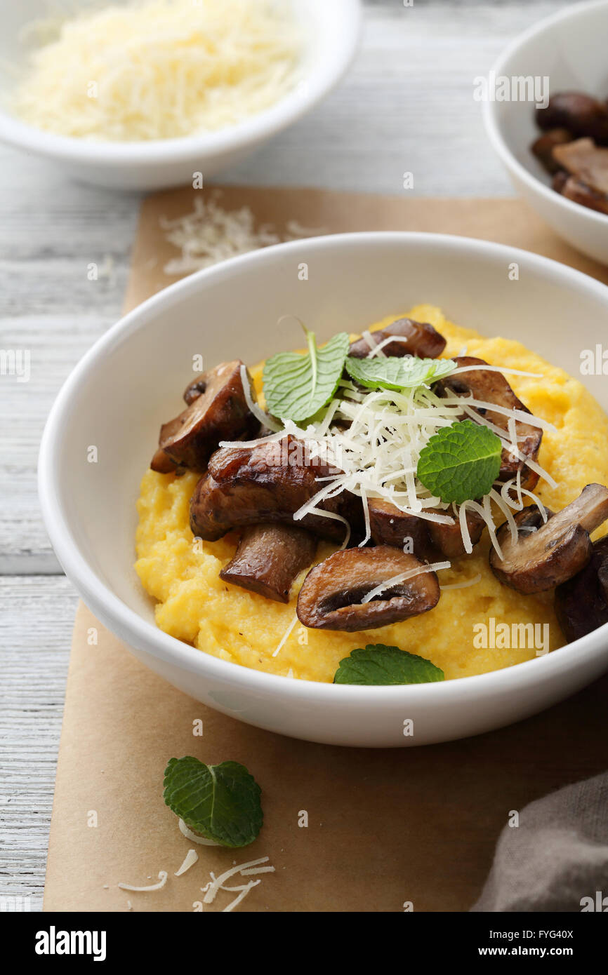 polenta with fried mushrooms and cheese Stock Photo Alamy