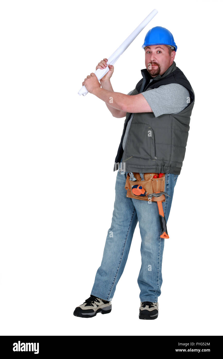 Construction worker taking aim with some plans Stock Photo