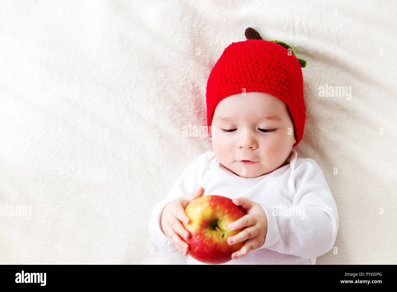 seven month old baby with apples Stock Photo Alamy