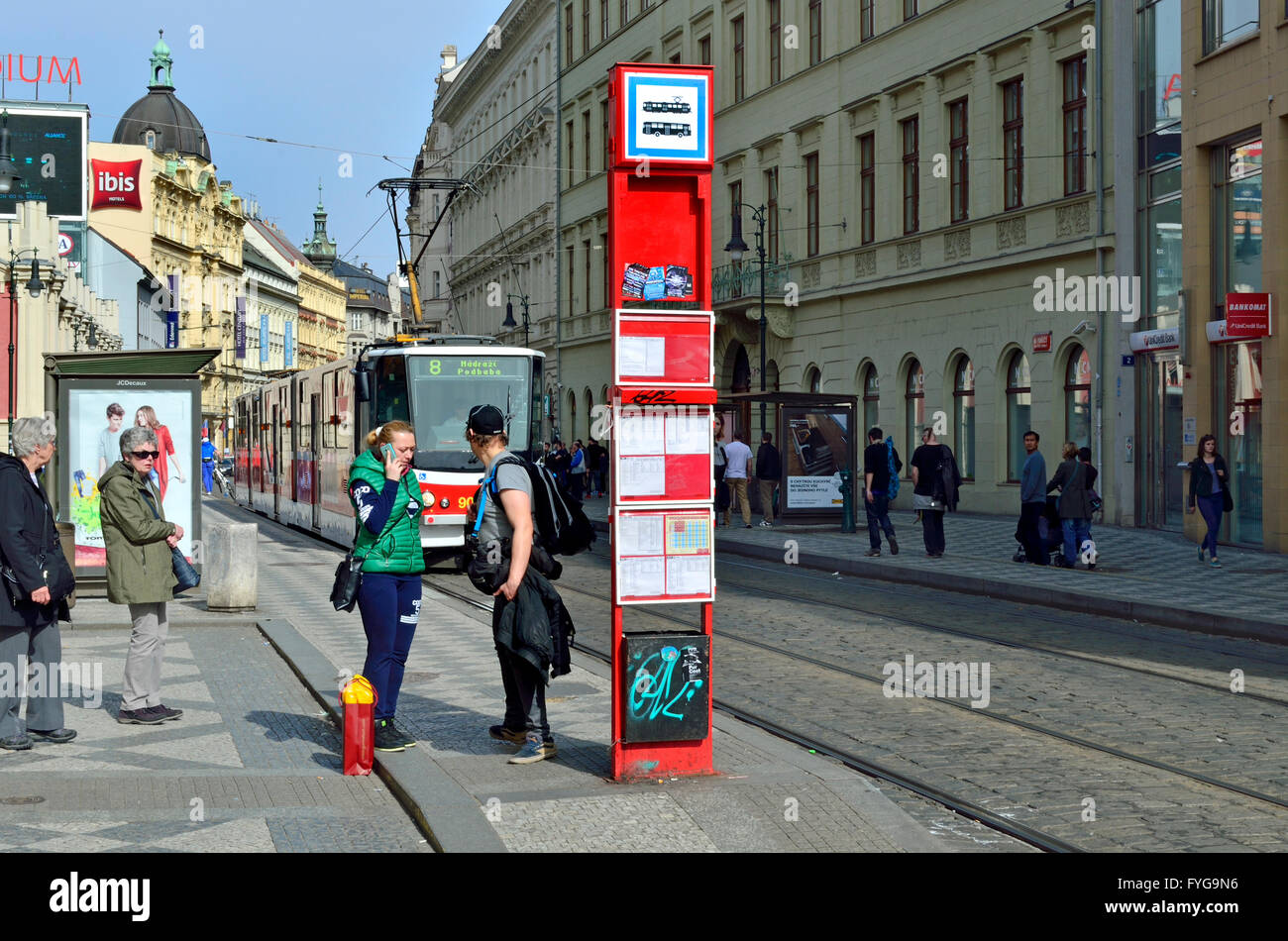 Prague, Czech Republic. Tram / streetcar approaching stop - people waiting. Stock Photo