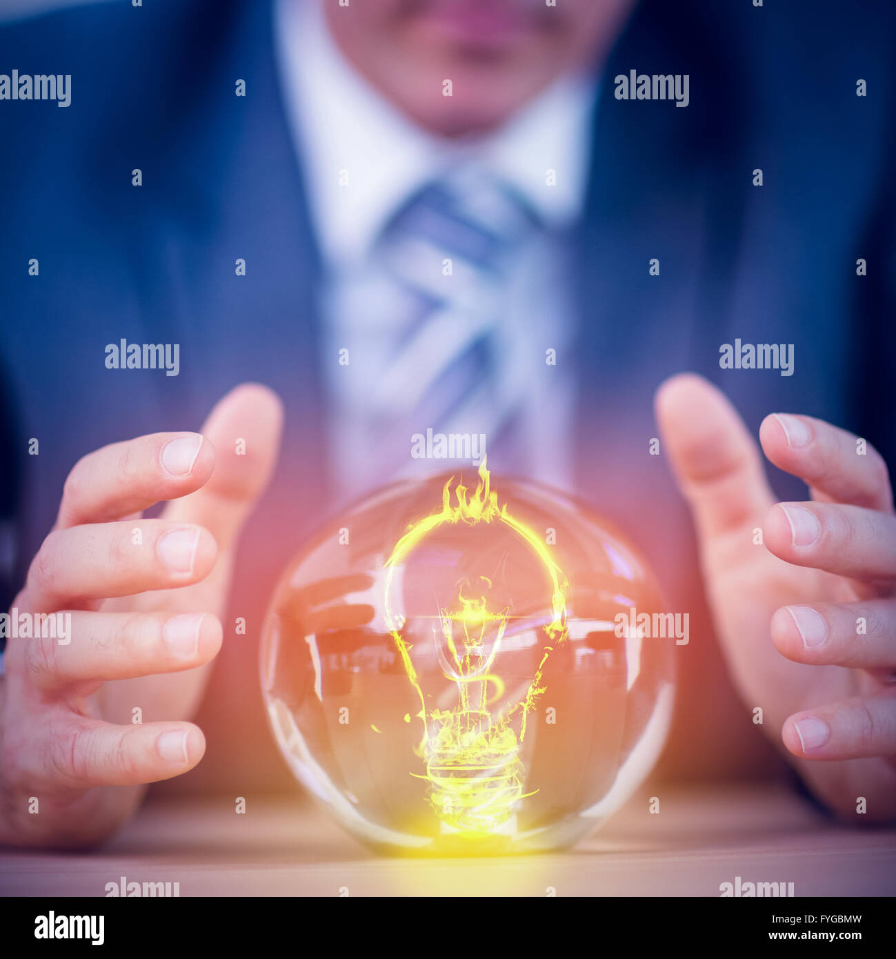 Composite image of bulb on fire on white background Stock Photo