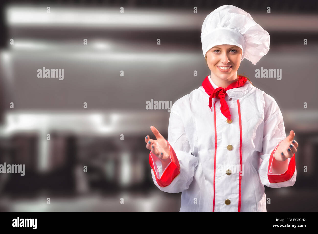 Composite image of pretty chef standing with hands out Stock Photo
