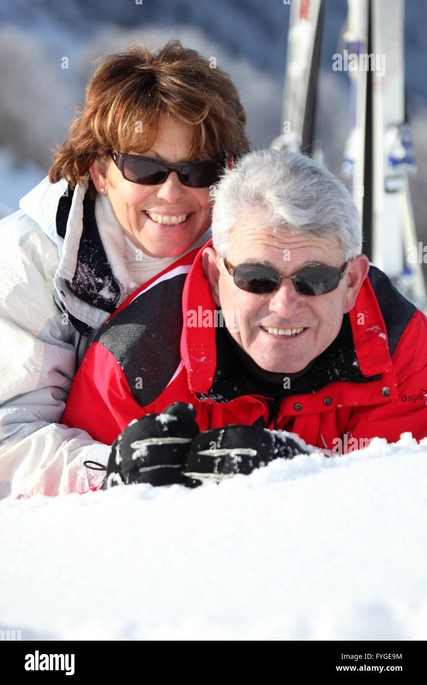 Middle-aged couple having fun on their skiing holiday Stock Photo