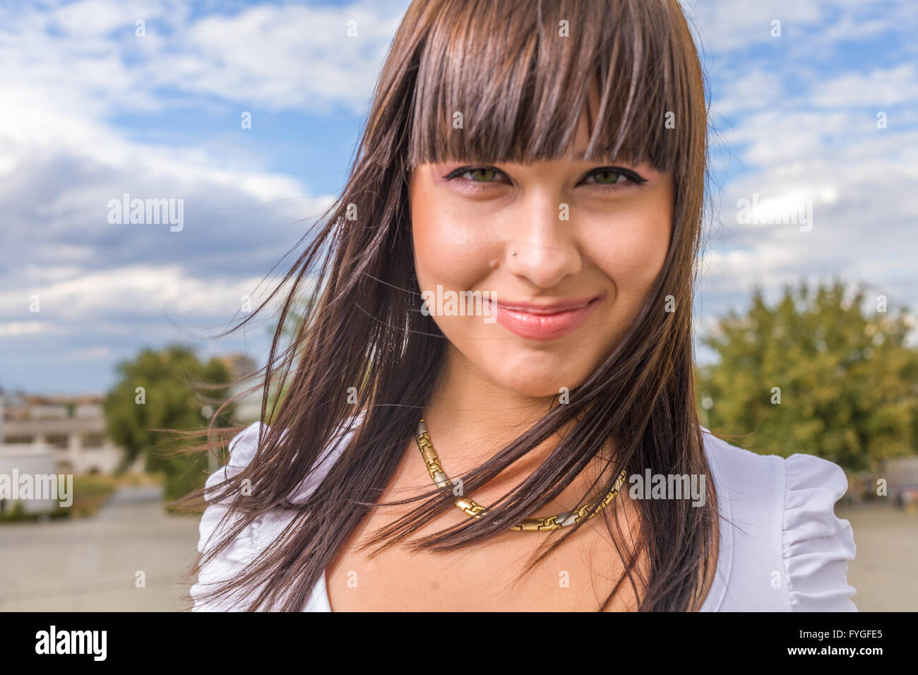 CloseUp Portrait Smiling Brunette Woman Outdoors Stock Photo - Alamy