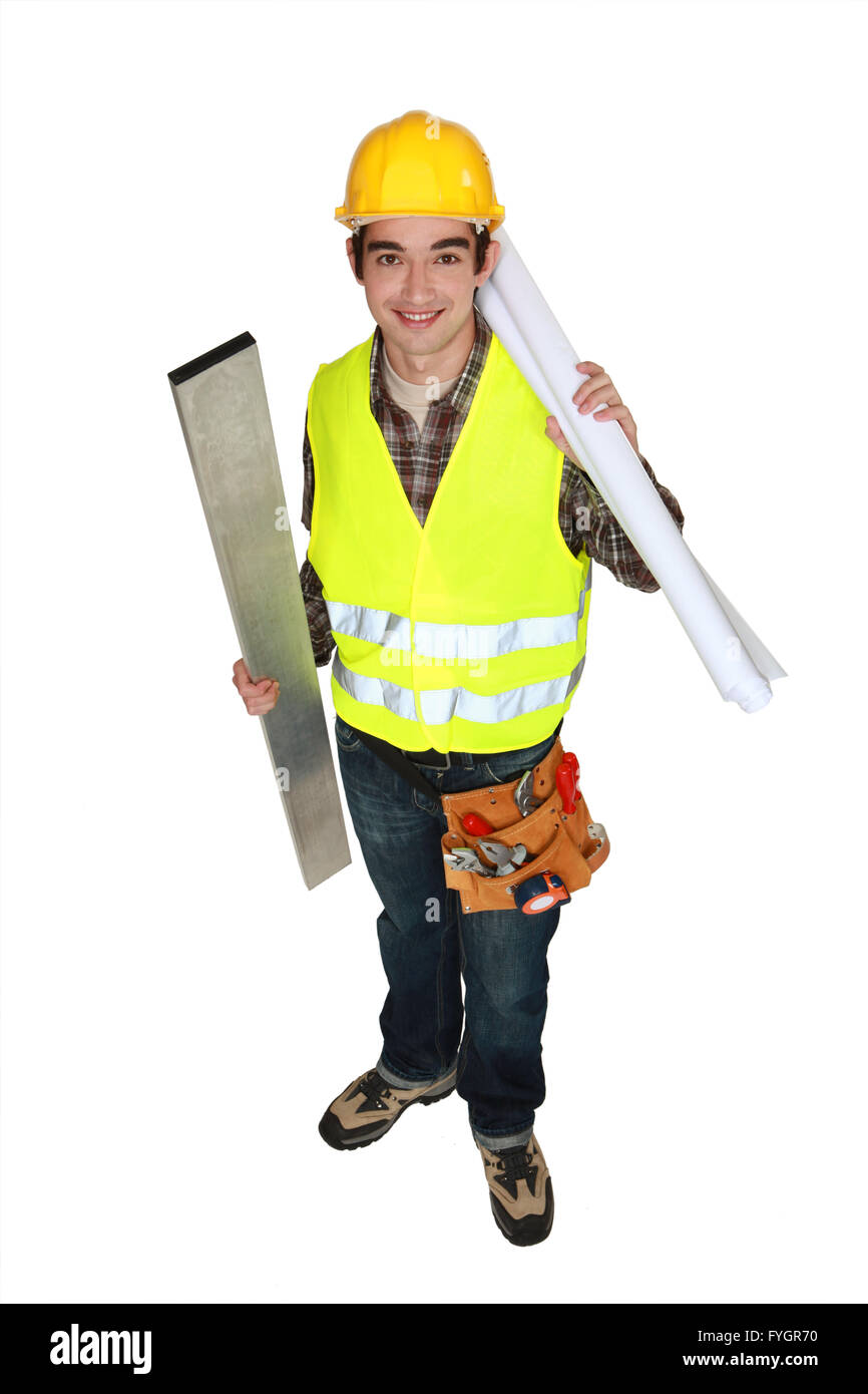portrait of young carpenter holding steel post and blueprints isolated