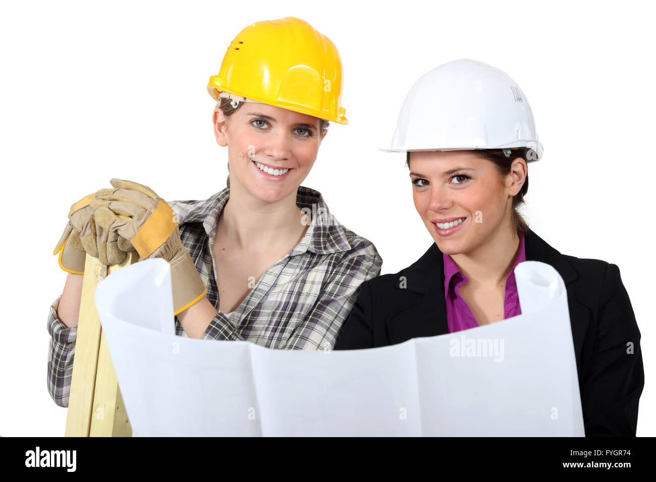 craftswoman and businesswoman looking at a blueprint Stock Photo - Alamy