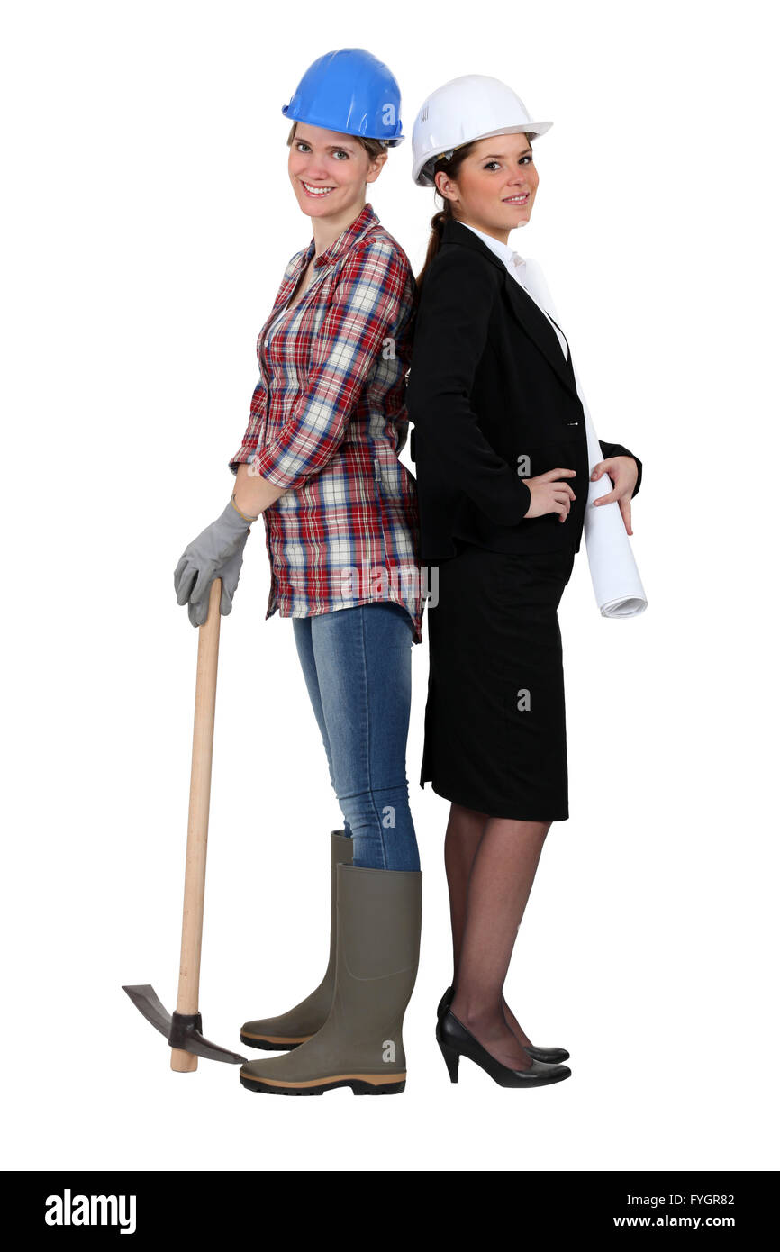 craftswoman and businesswoman standing back to back Stock Photo - Alamy