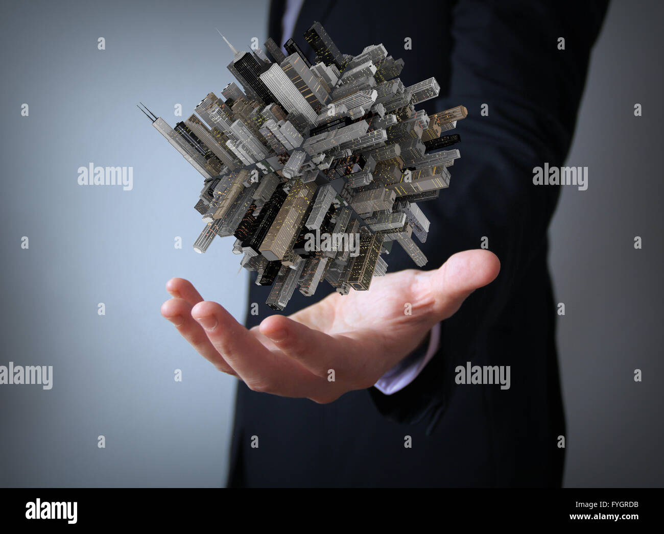 big city on a cube over businessman hand Stock Photo