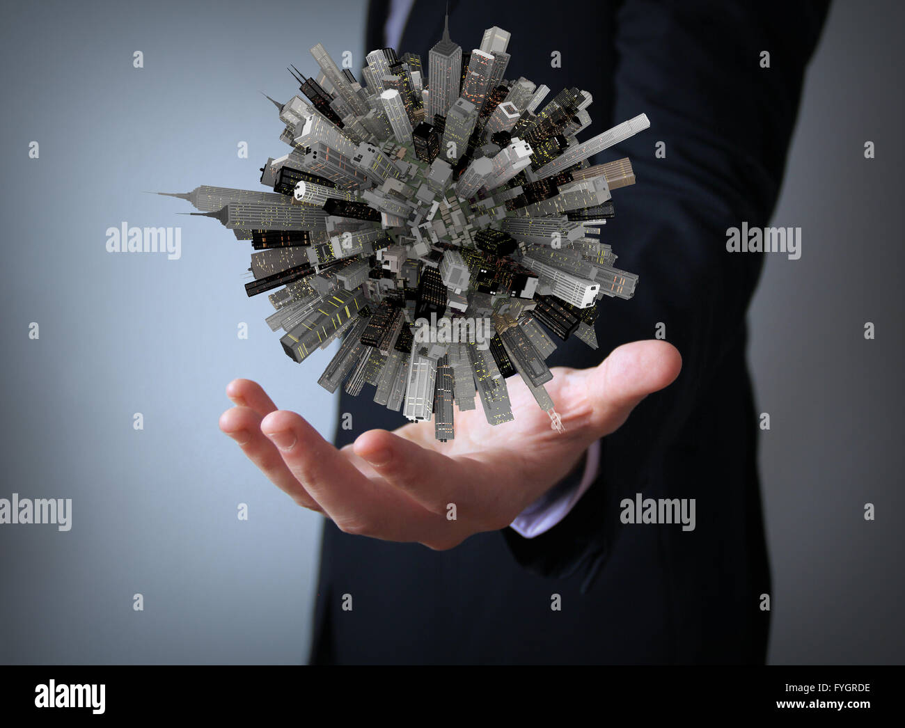 big city on small planet over businessman hand Stock Photo