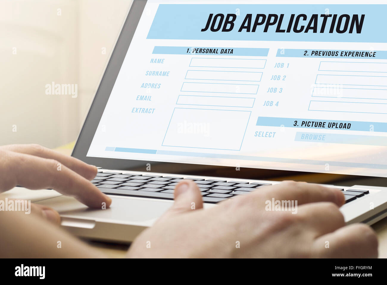 job search concept: man using a laptop with job application on the screen Stock Photo