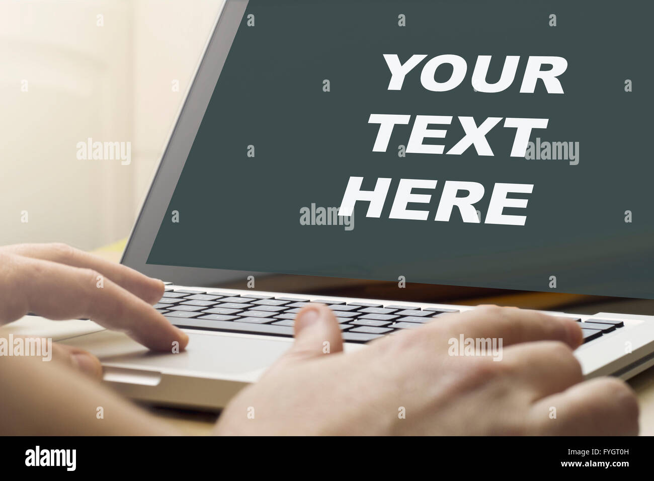 man using a laptop with your text here on the screen. Screen graphics ...