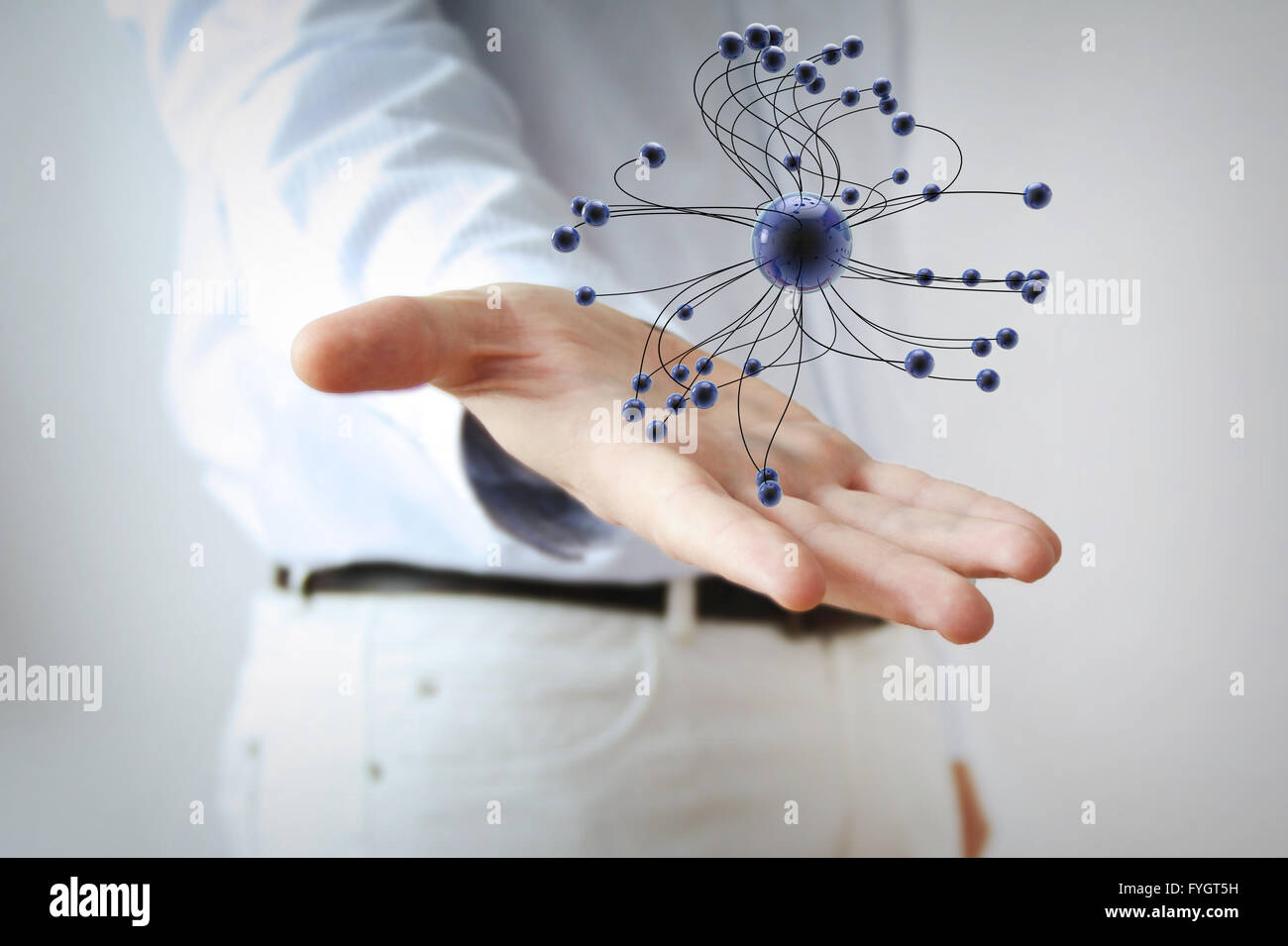 atomic concept: 3d tied balls structure over a hand Stock Photo