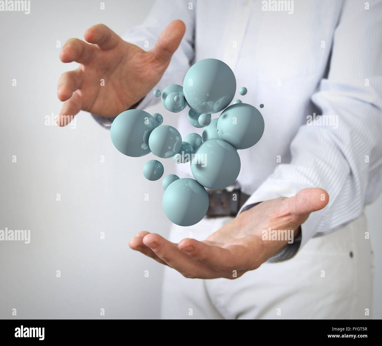 connection concept: glossy 3d balls between hands Stock Photo