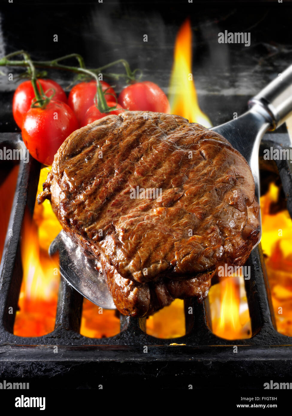 Beef fillet steaks being pan fried on a open flames Stock Photo Alamy