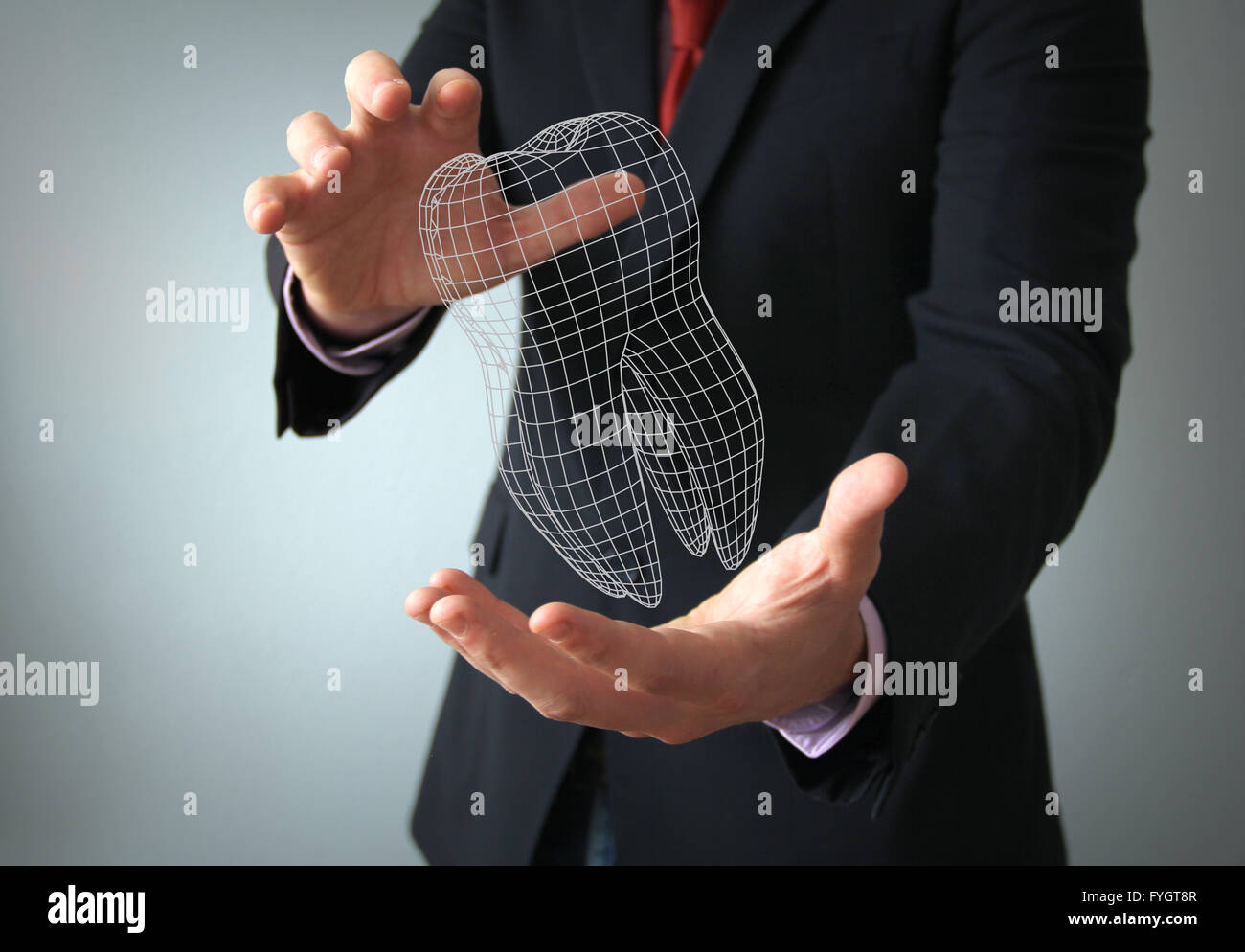 dental implant design concept: 3d tooth wire on a businessman hands Stock Photo