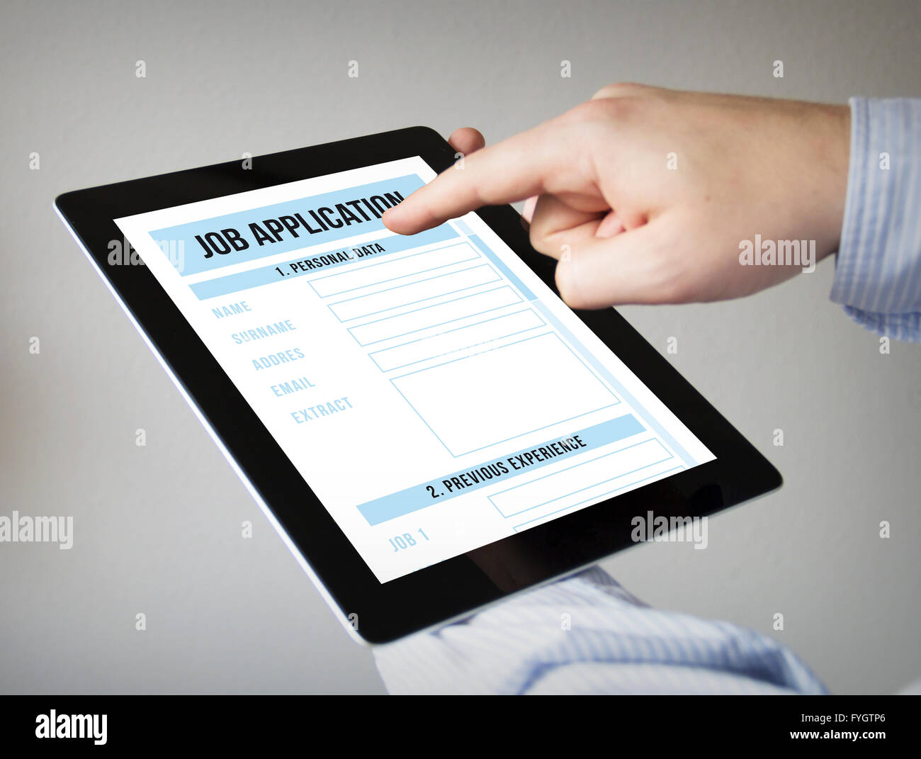 new technologies concept: hands with touchscreen tablet with job application form Stock Photo