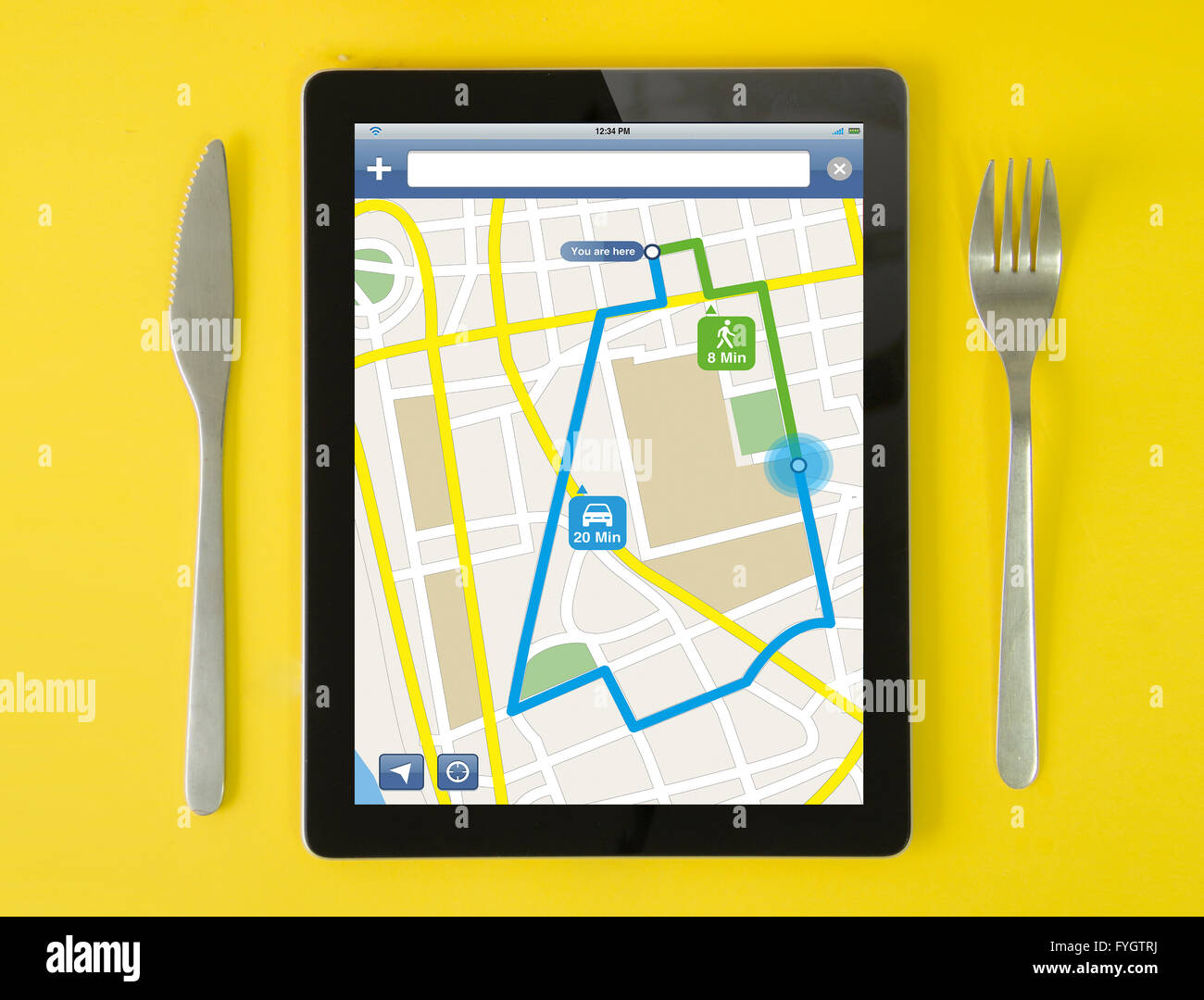 tablet gps concept: hipster breakfast with route planner app on a tablet screen. screen graphics are made up. Stock Photo
