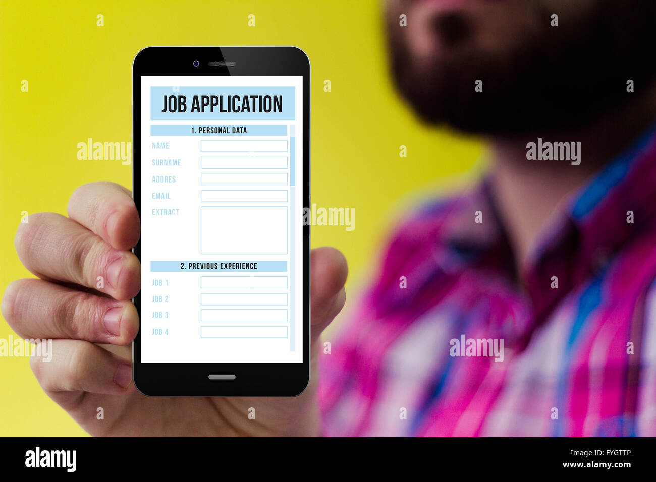 job search concept: Hipster with beard and checked shirt holding a smartphone with online job application form on the screen Stock Photo