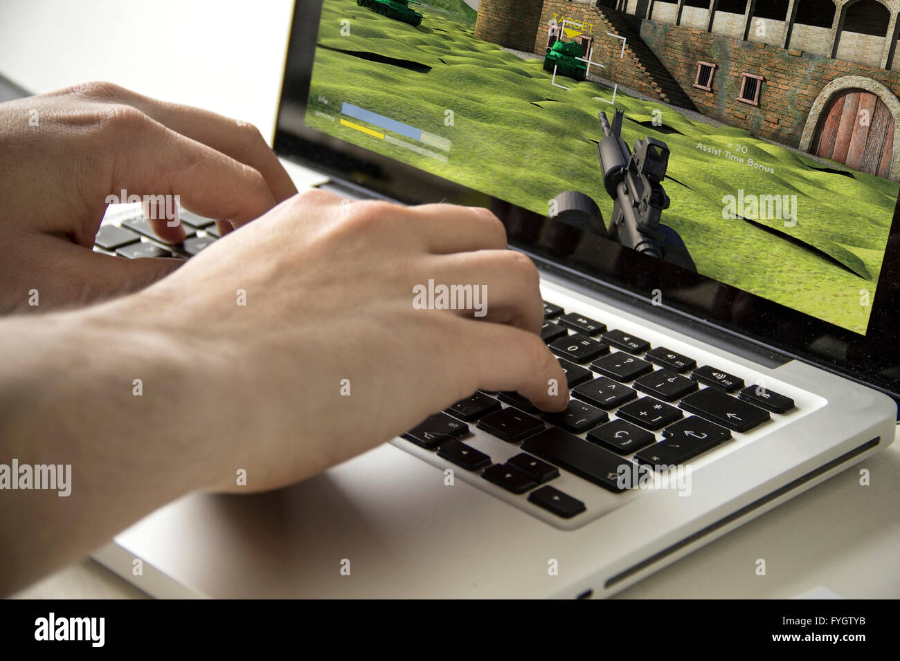 leisure or dependence concept: Man playing a computer game Stock Photo