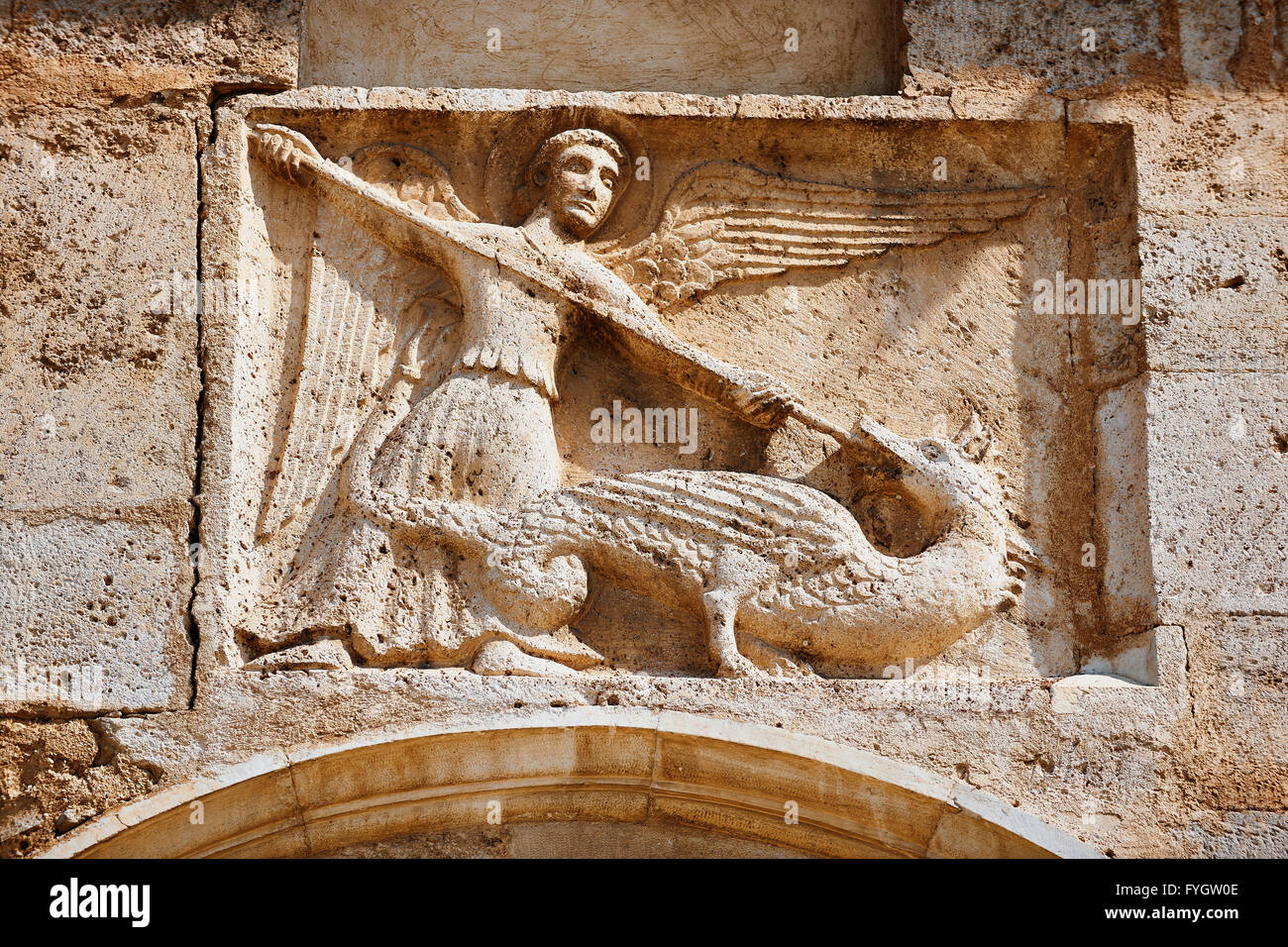 Sculpture of St Michael killing a dragon, 12th century Romanesque Stock  Photo - Alamy